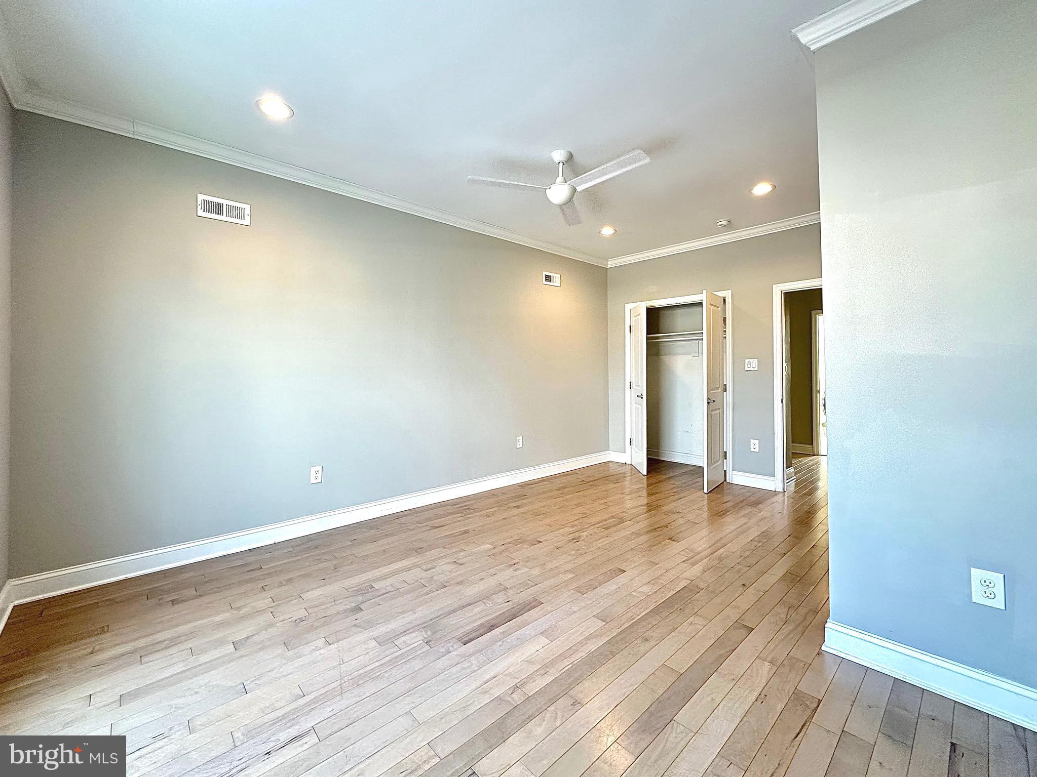 2514 West Seybert Street Philadelphia, PA 19121 - Photo 27 of 38 a view of an empty room with wooden floor