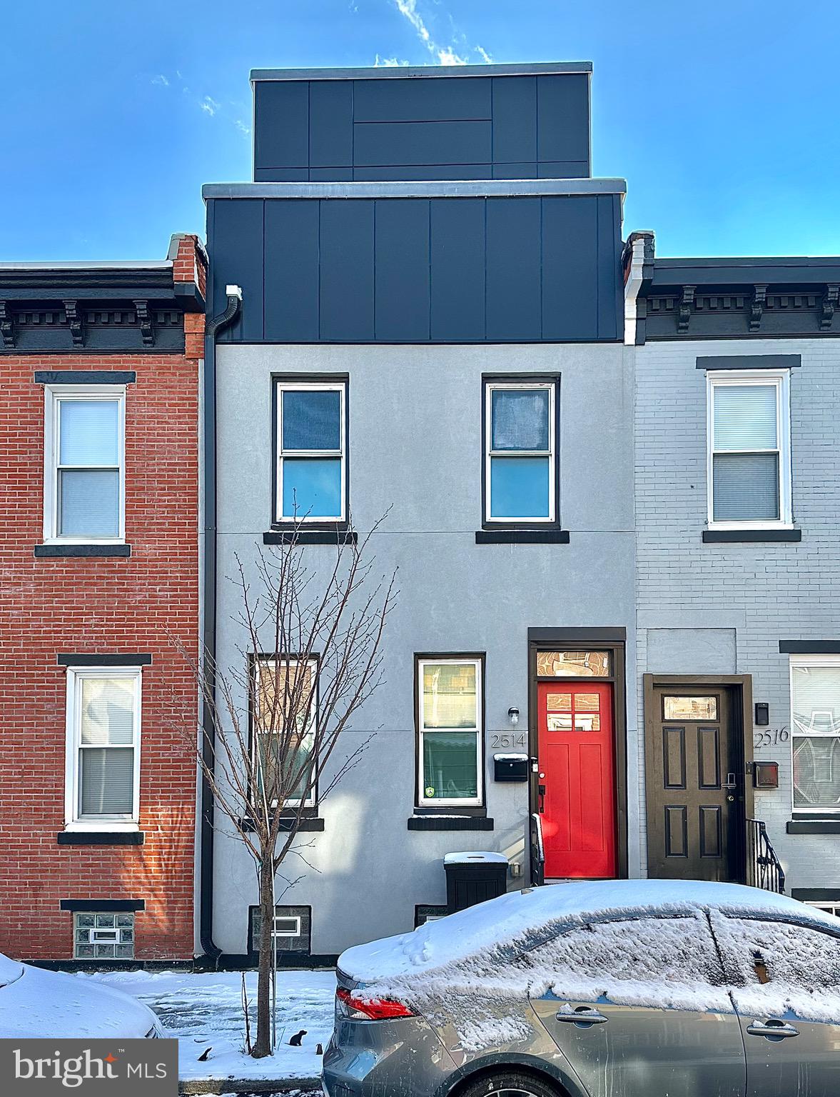 2514 West Seybert Street Philadelphia, PA 19121 - Photo 36 of 38 a front view of a house with a yard