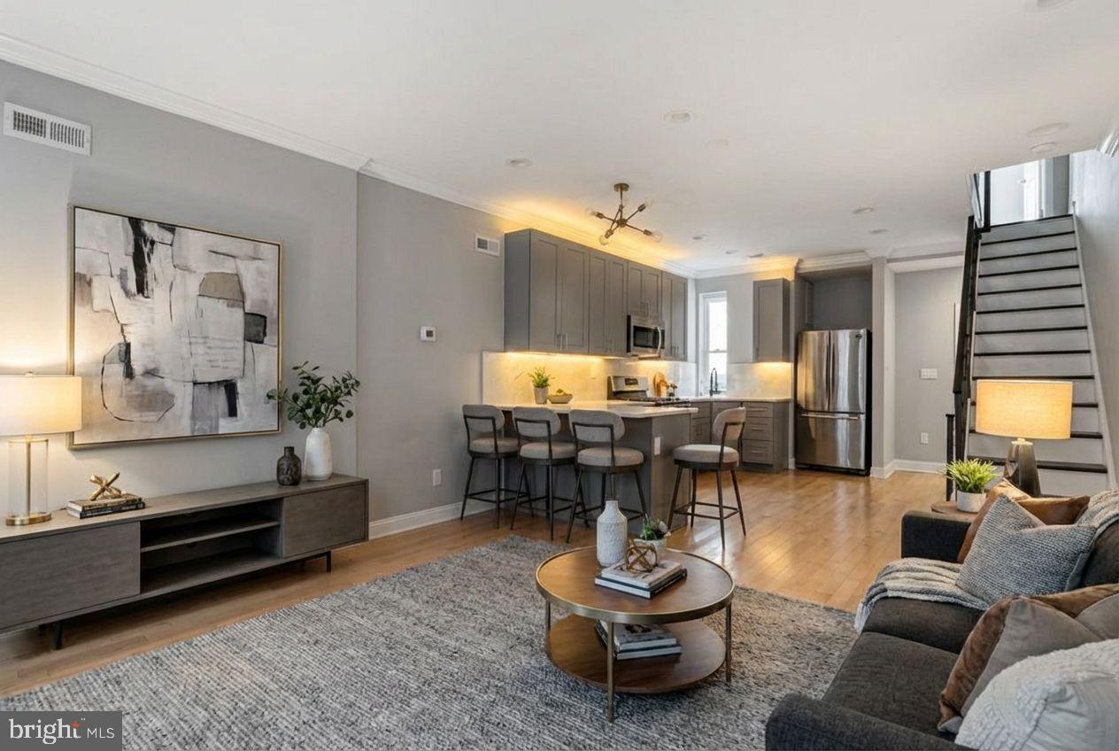 2514 West Seybert Street Philadelphia, PA 19121 - Photo 4 of 38 a living room with furniture and wooden floor