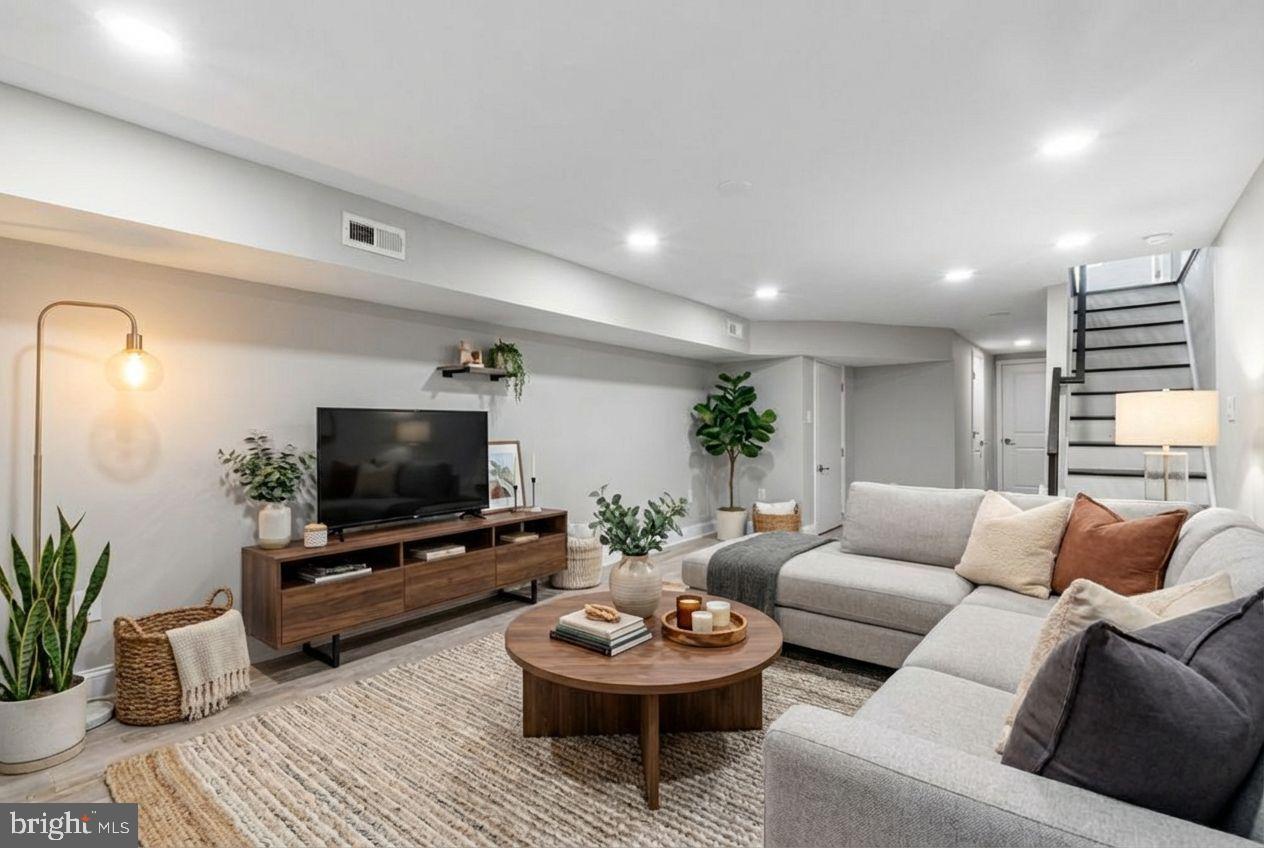 2514 West Seybert Street Philadelphia, PA 19121 - Photo 9 of 38 a living room with furniture and a flat screen tv