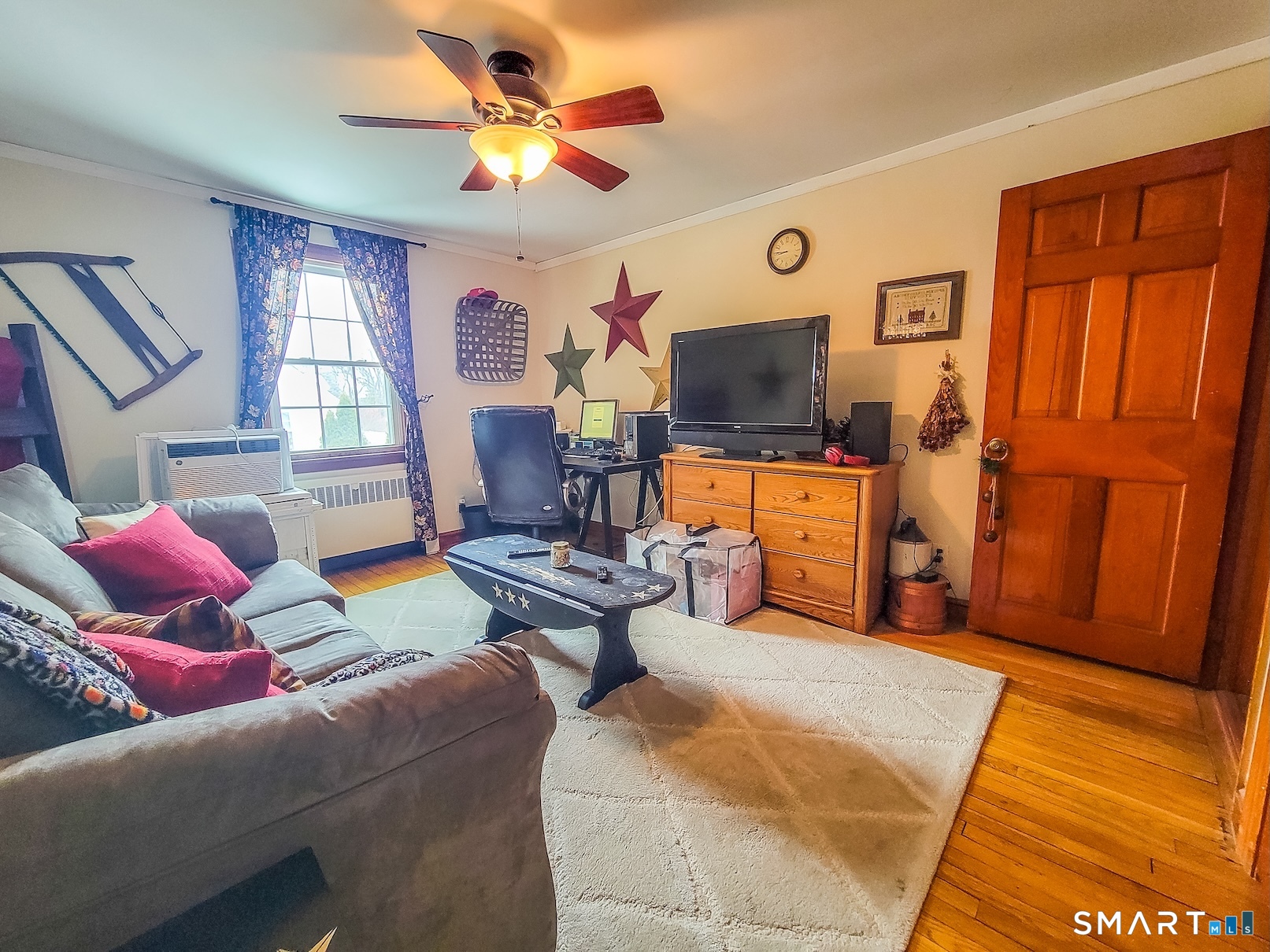 71 Cedar Lane Wallingford, CT 06492 - Photo 15 of 26 a living room with furniture and a flat screen tv