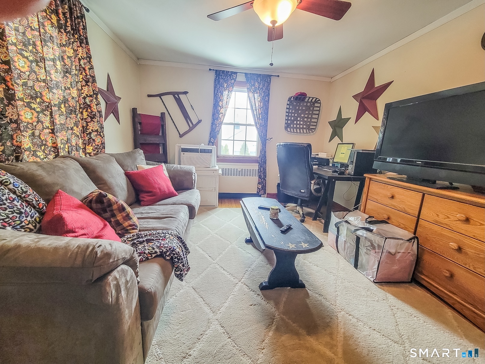 71 Cedar Lane Wallingford, CT 06492 - Photo 16 of 26 a living room with furniture and a flat screen tv