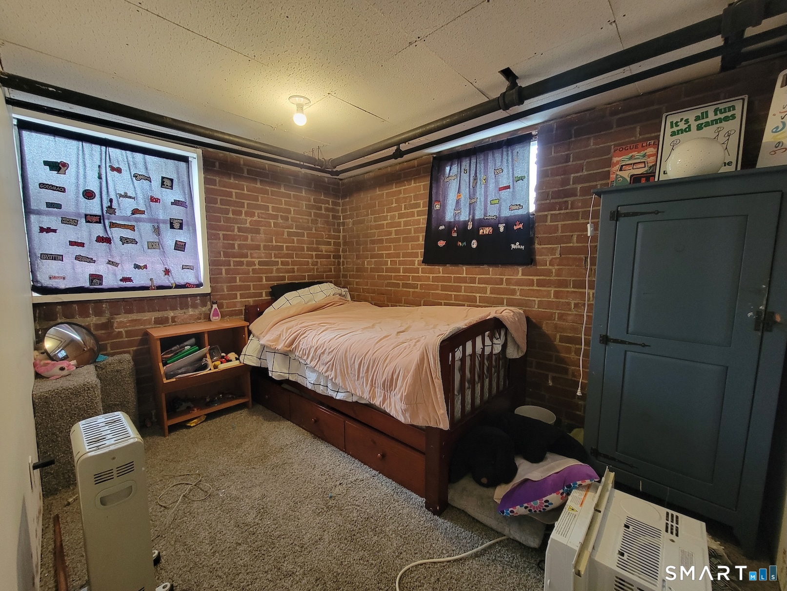 71 Cedar Lane Wallingford, CT 06492 - Photo 23 of 26 a bedroom with a bed and a wall painting