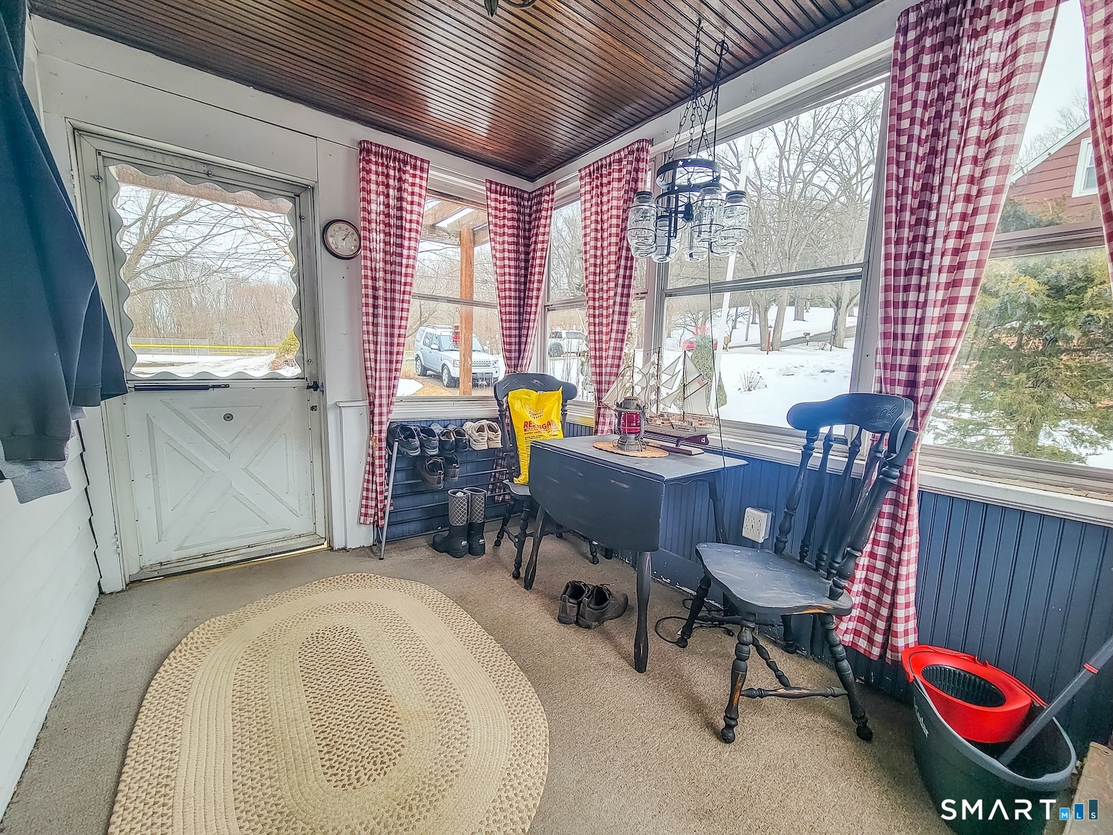 71 Cedar Lane Wallingford, CT 06492 - Photo 24 of 26 a view of a dining room with furniture a chandelier and wooden floor
