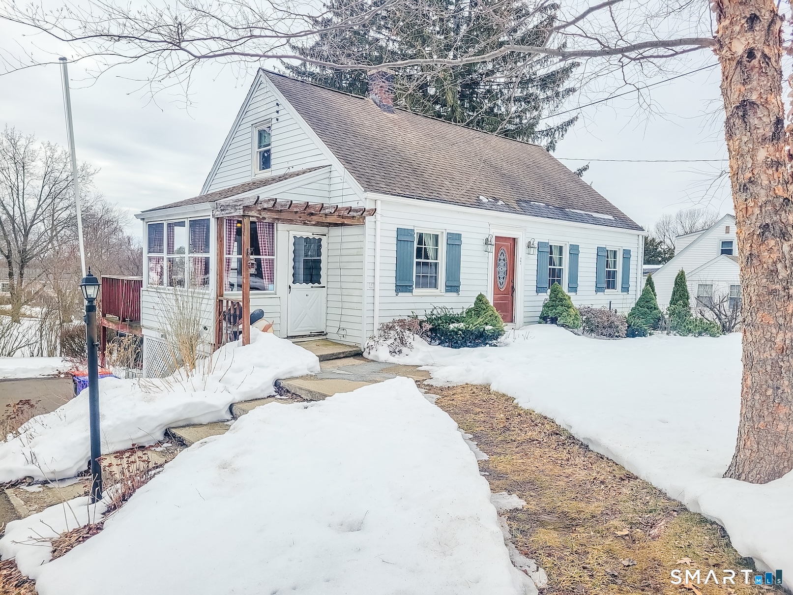 71 Cedar Lane Wallingford, CT 06492 - Photo 25 of 26 a front view of a house with a yard and table and chairs