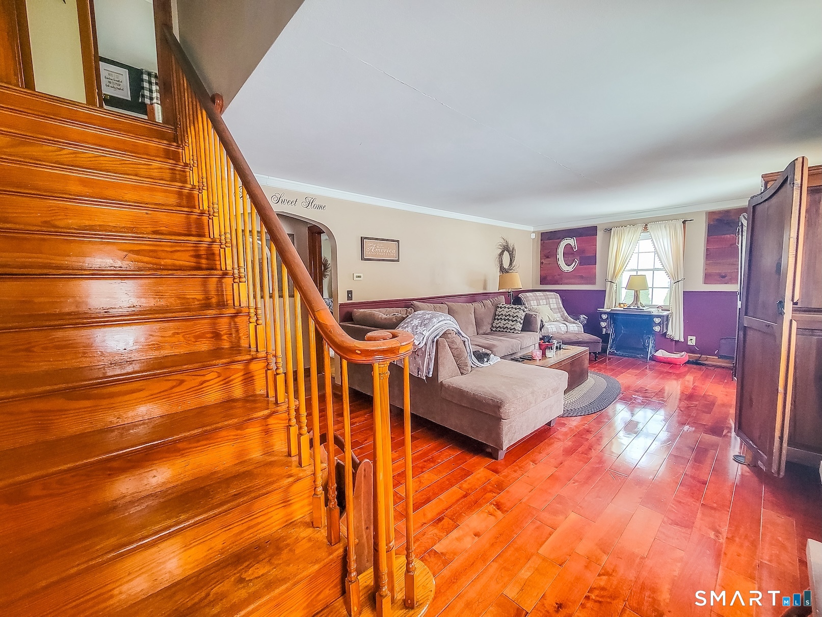 71 Cedar Lane Wallingford, CT 06492 - Photo 10 of 26 a living room with furniture and a painting