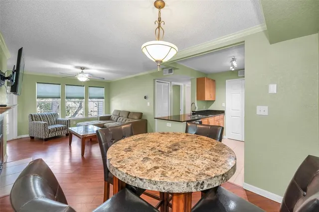 a view of a dining room with furniture window and wooden floor