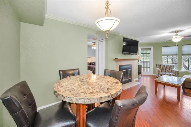 a view of a dining room with furniture window and wooden floor