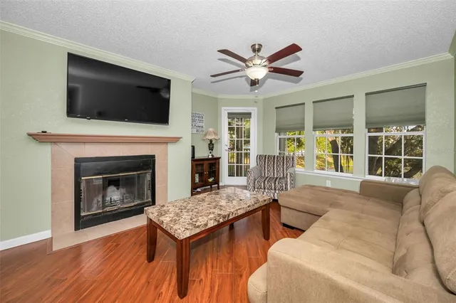 a living room with furniture fireplace and flat screen tv