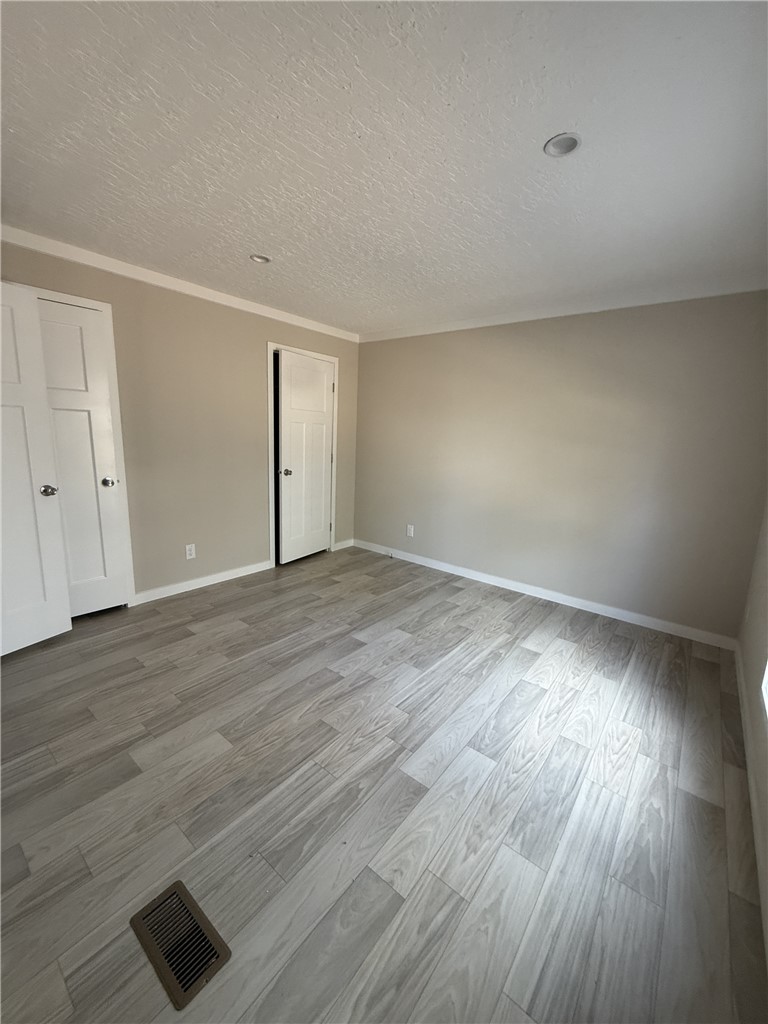 121 Candlestick Lane Seneca, SC 29678 - Photo 12 of 17 This spacious room features elegant flooring and offers a comfortable living space.