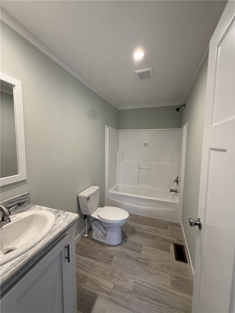 121 Candlestick Lane Seneca, SC 29678 - Photo 16 of 17 This clean bathroom features modern fixtures and wood-look flooring for a contemporary feel.