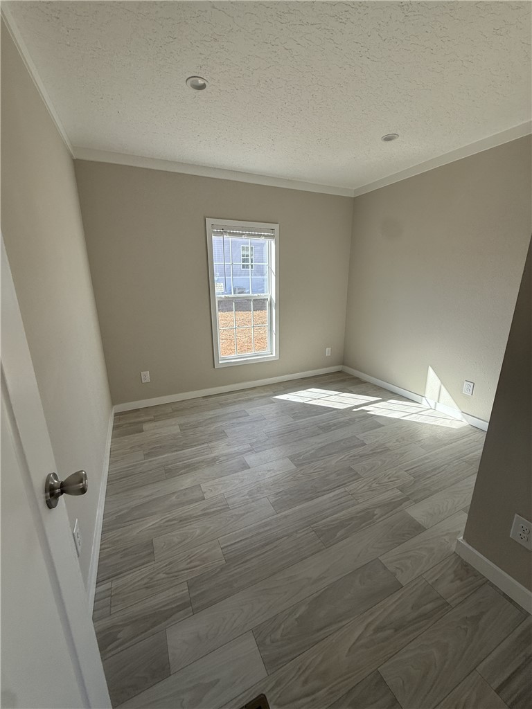 121 Candlestick Lane Seneca, SC 29678 - Photo 17 of 17 This versatile room features durable flooring, creating a comfortable and inviting atmosphere for various uses.