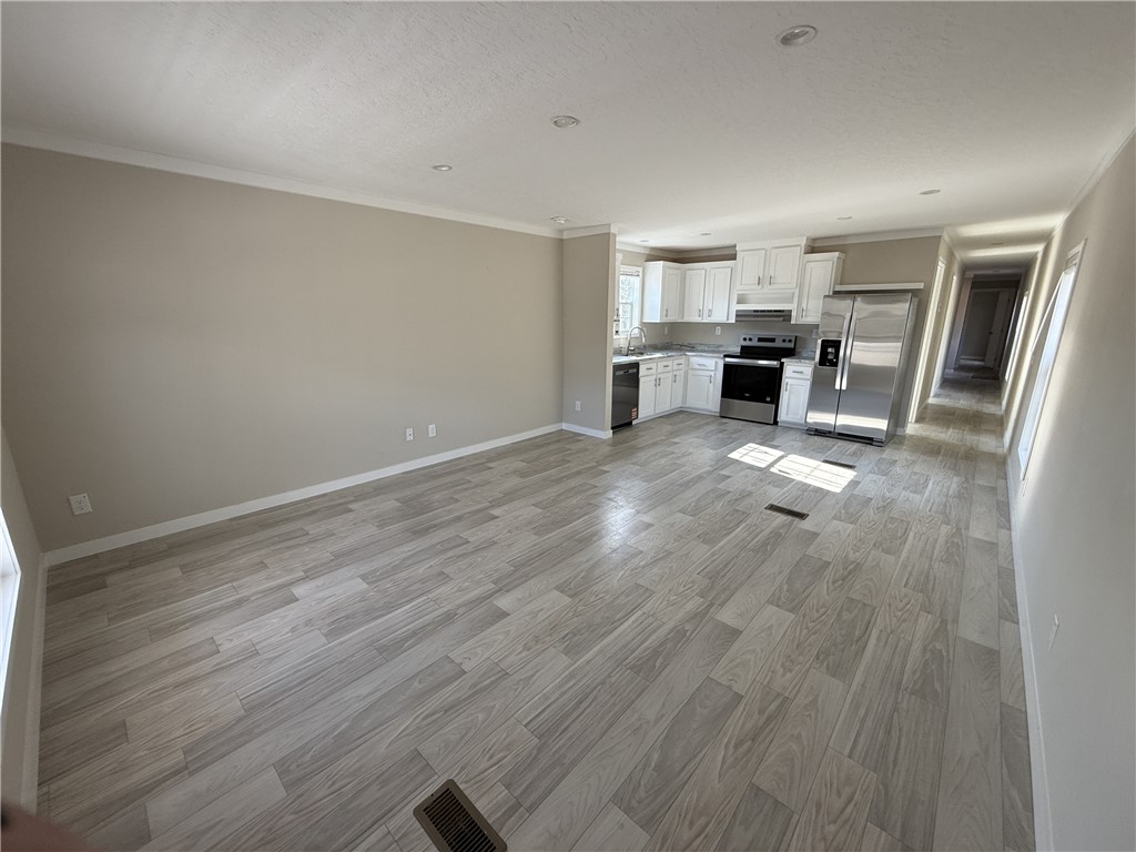 121 Candlestick Lane Seneca, SC 29678 - Photo 4 of 17 This luminous open-concept layout integrates living space with a pristine kitchen.