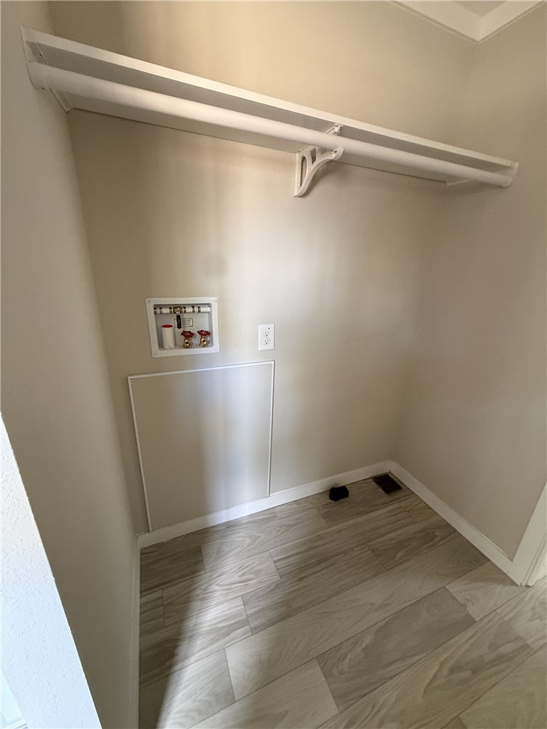 121 Candlestick Lane Seneca, SC 29678 - Photo 6 of 17 Functional laundry space with a convenient hanging rod and durable flooring.