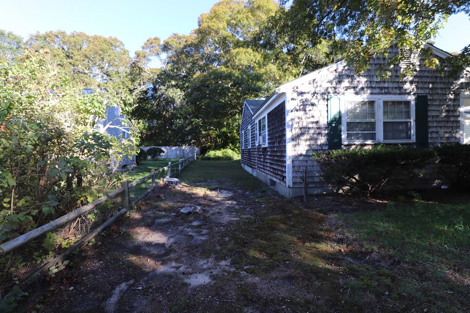 58 Sterling Road Hyannis, MA 02601 - Photo 14 of 19 a backyard of a house with lots of green space
