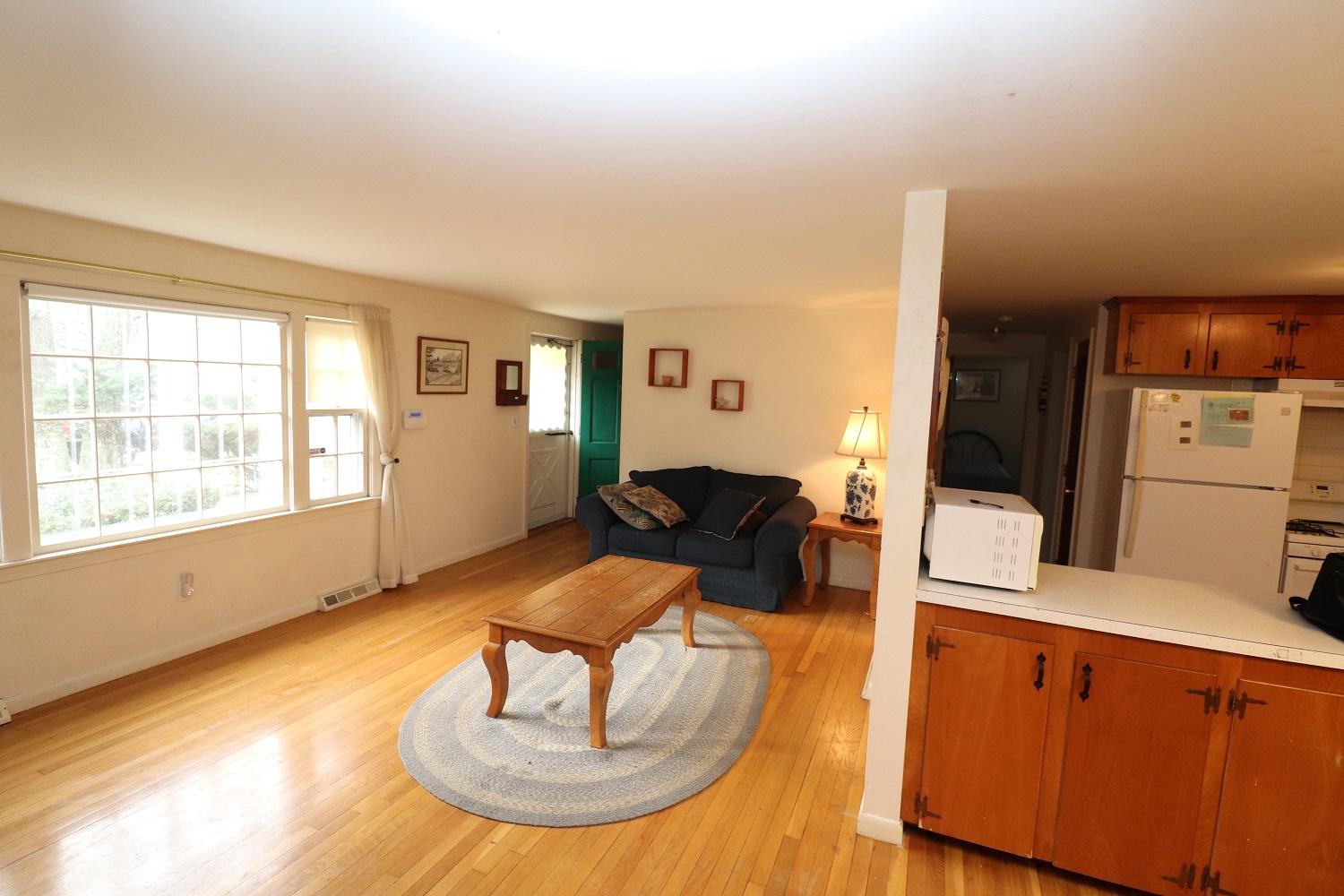 58 Sterling Road Hyannis, MA 02601 - Photo 6 of 19 a living room with furniture flowerpot and wooden floor