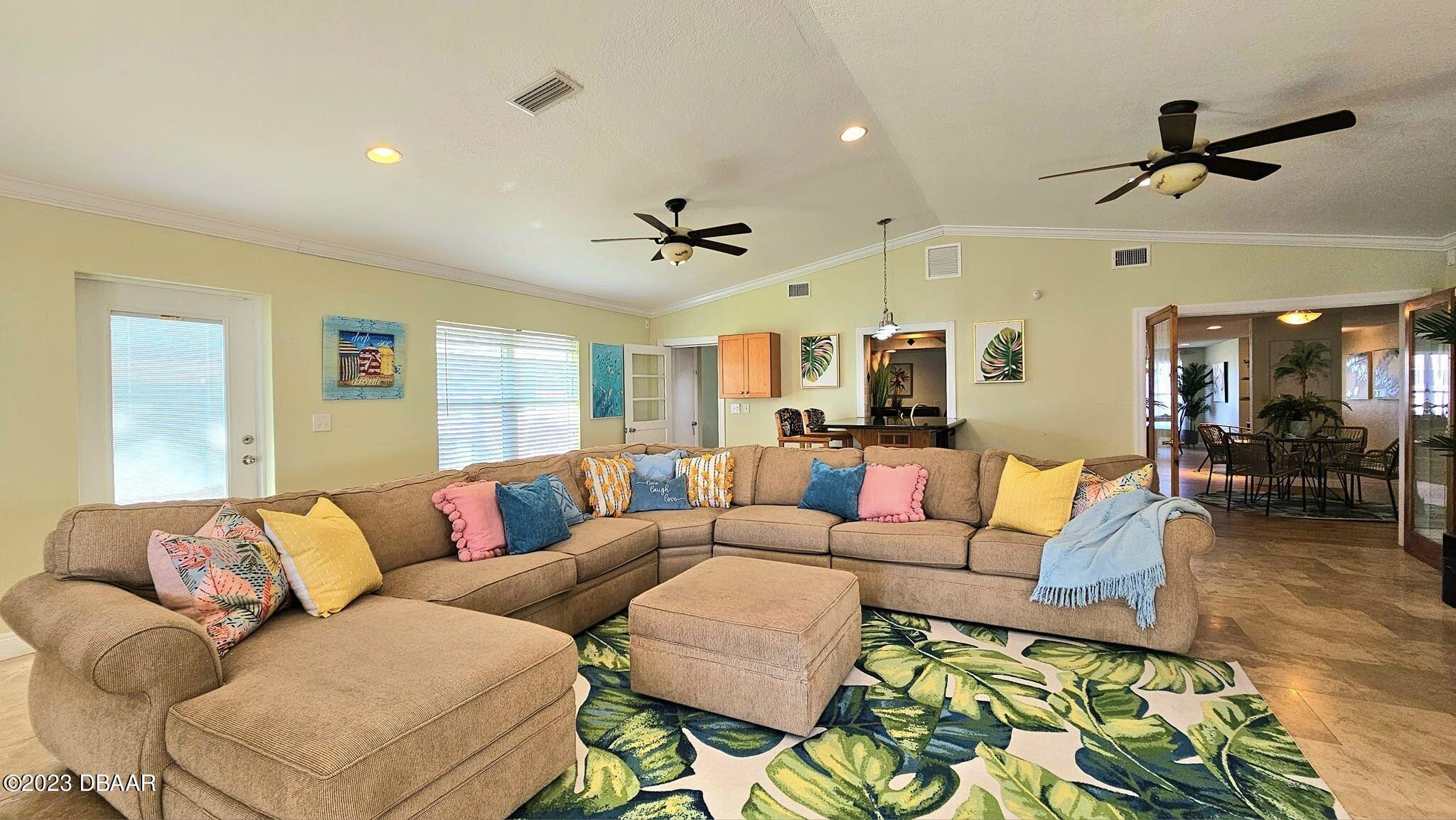 6 Sunrise Avenue Ormond Beach, FL 32176 - Photo 11 of 83 a living room with furniture ceiling fan and a rug