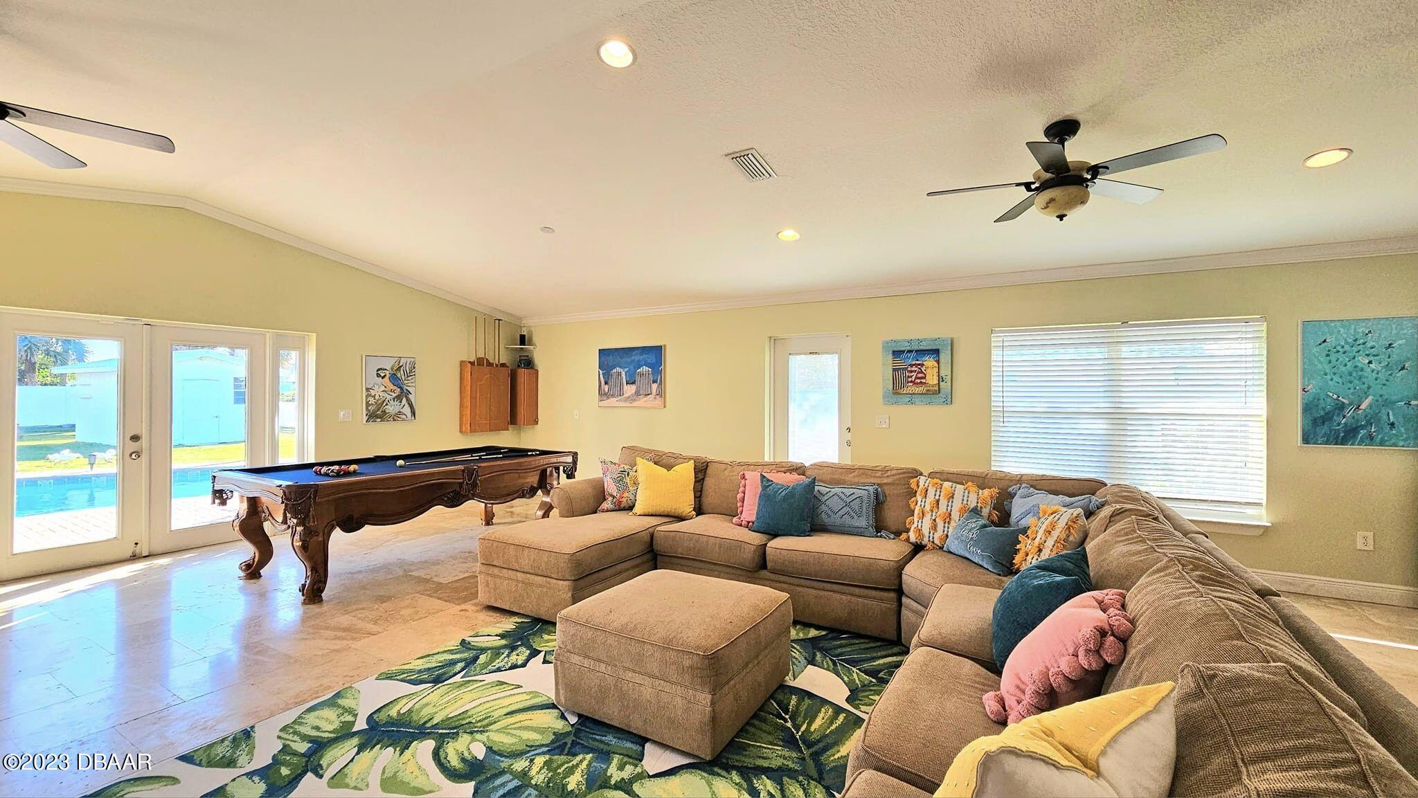 6 Sunrise Avenue Ormond Beach, FL 32176 - Photo 12 of 83 a living room with furniture and a large window