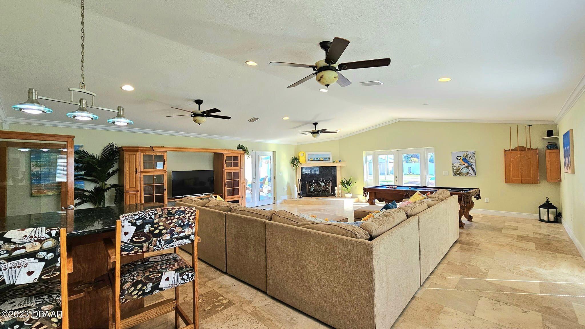 6 Sunrise Avenue Ormond Beach, FL 32176 - Photo 15 of 83 a living room with furniture and a flat screen tv