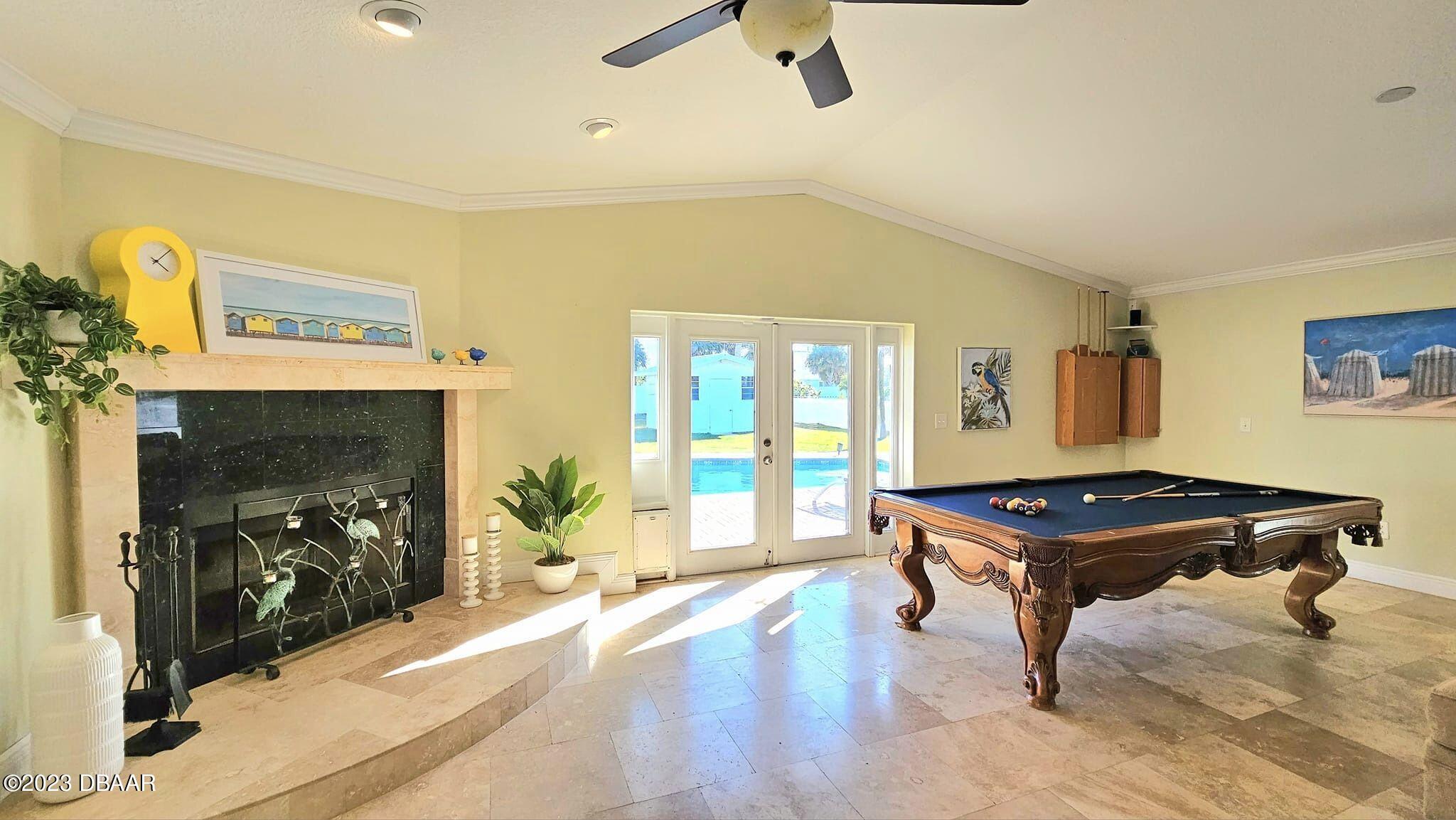 6 Sunrise Avenue Ormond Beach, FL 32176 - Photo 17 of 83 a room with furniture and a fireplace