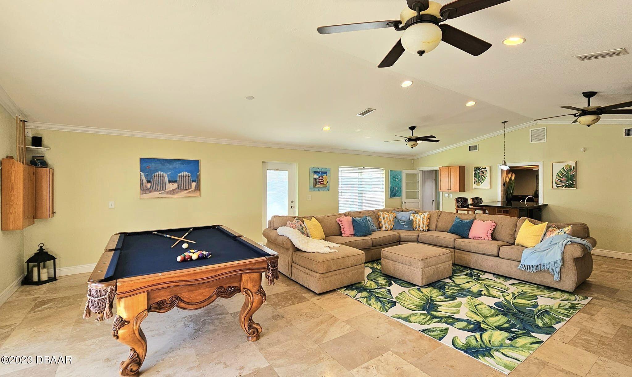6 Sunrise Avenue Ormond Beach, FL 32176 - Photo 19 of 83 a living room with furniture and a flat screen tv