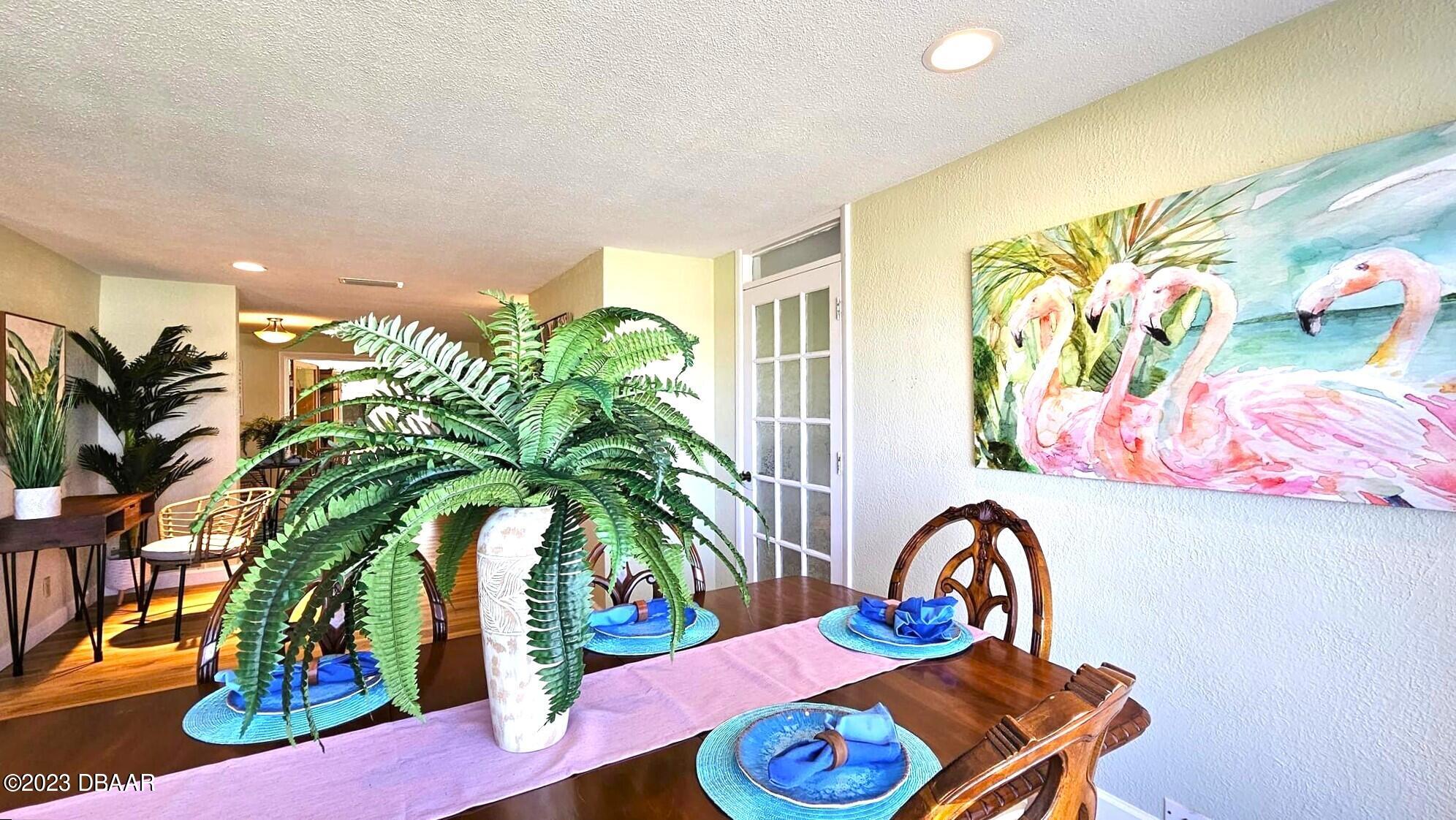 6 Sunrise Avenue Ormond Beach, FL 32176 - Photo 26 of 83 a living room with furniture and a potted plant