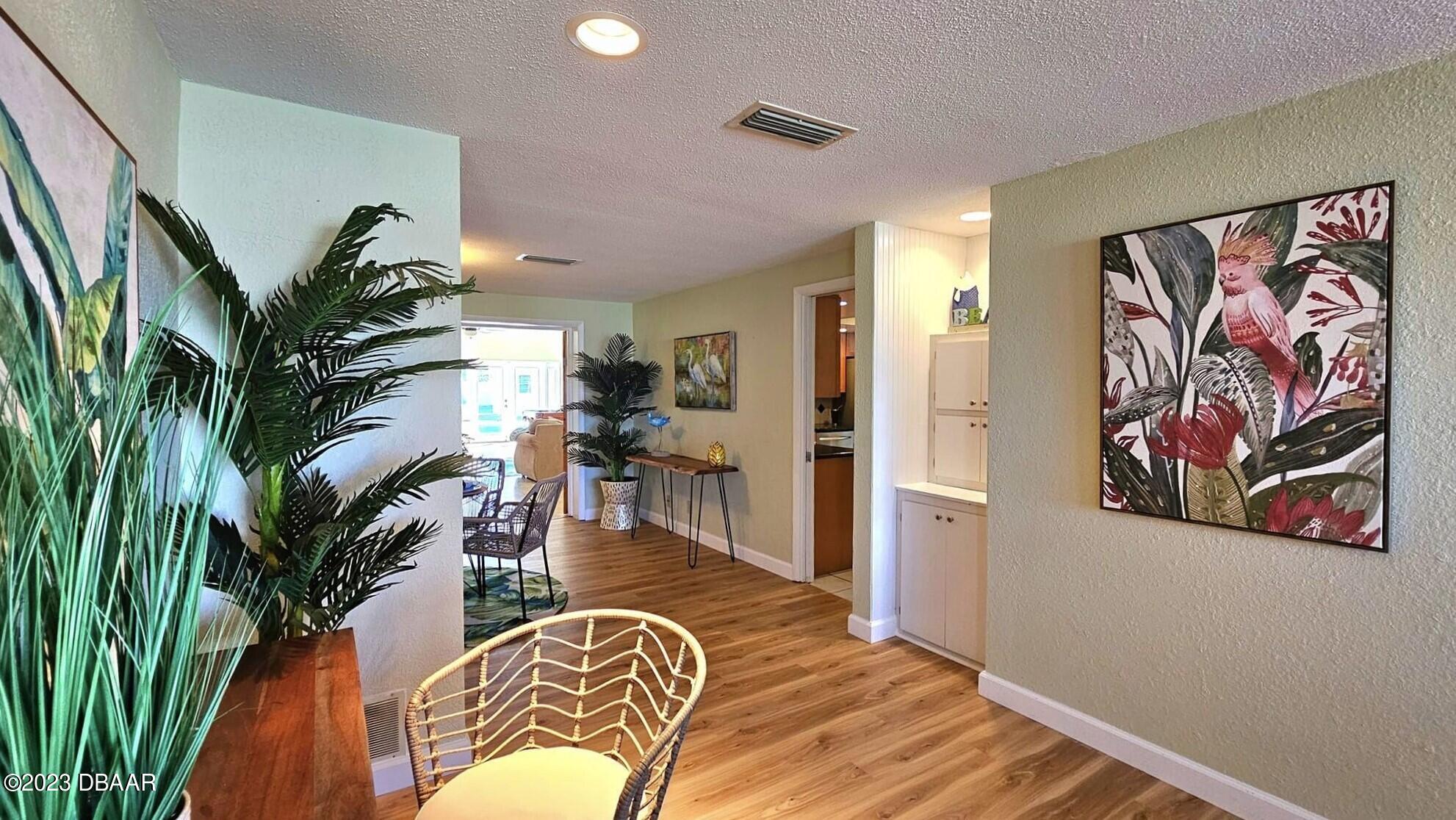 6 Sunrise Avenue Ormond Beach, FL 32176 - Photo 28 of 83 a view of a livingroom with furniture and a potted plant