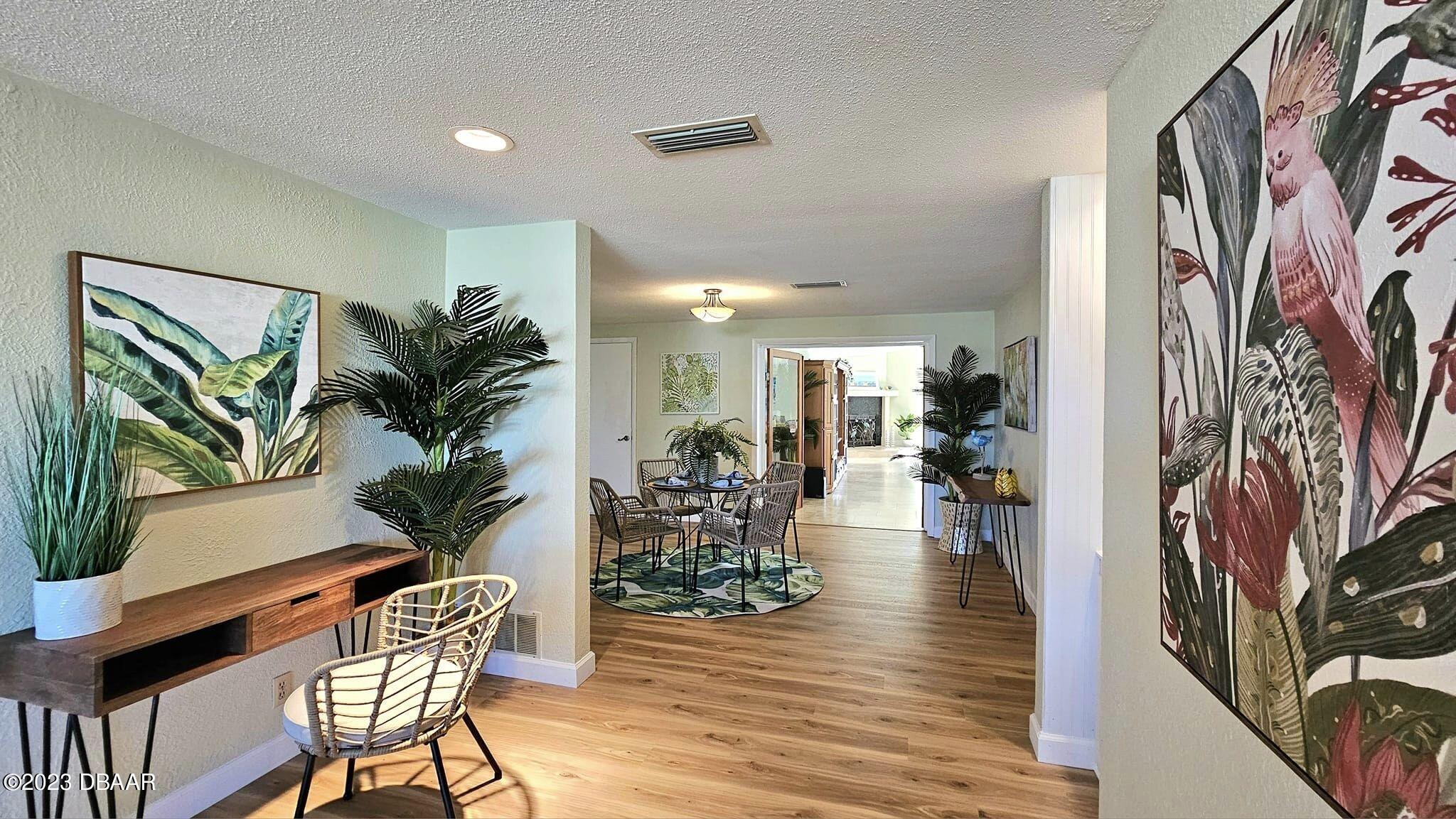 6 Sunrise Avenue Ormond Beach, FL 32176 - Photo 30 of 83 a living room with furniture and a wooden floor