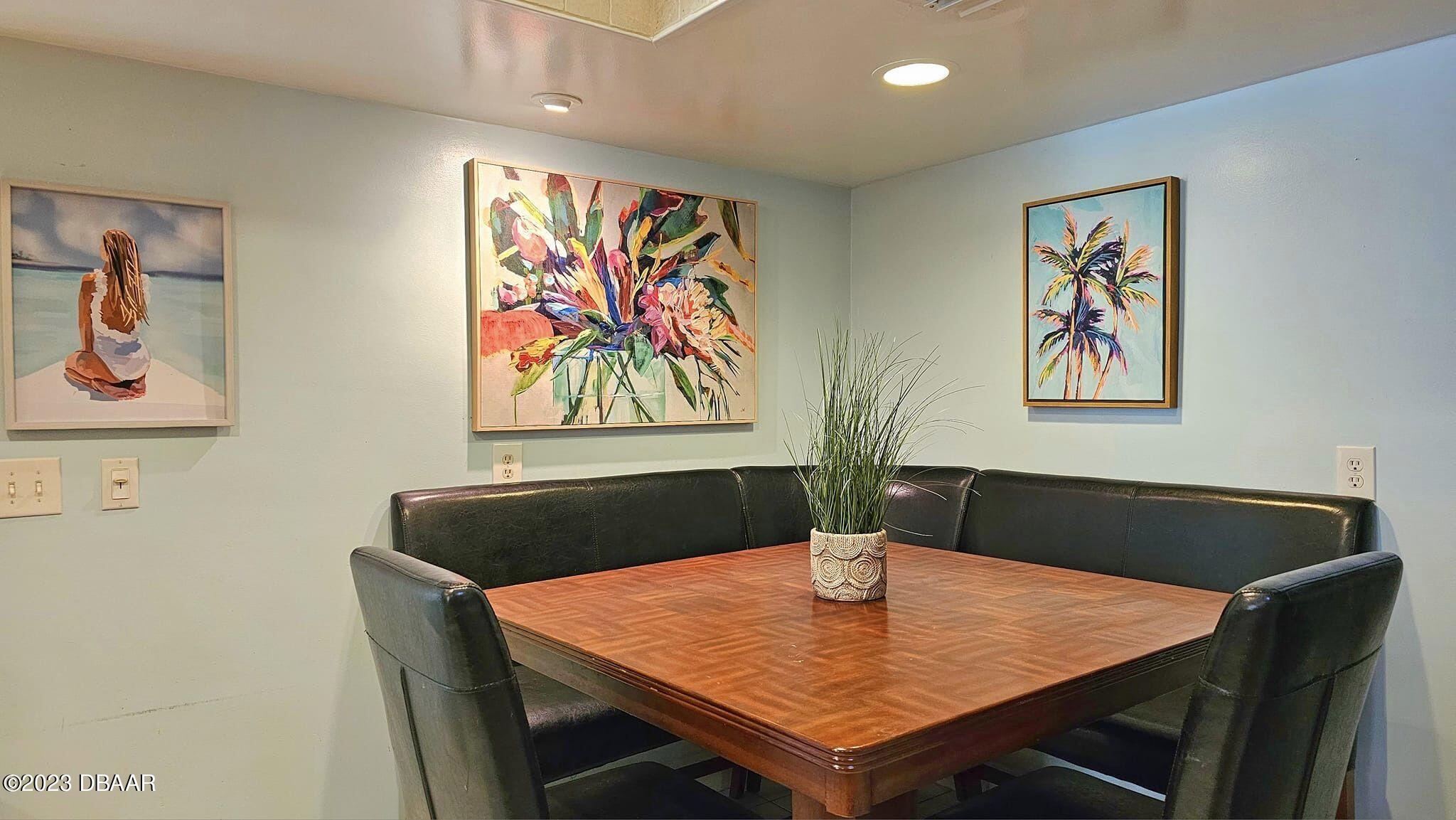 6 Sunrise Avenue Ormond Beach, FL 32176 - Photo 40 of 83 a view of a dining room with furniture and wooden floor