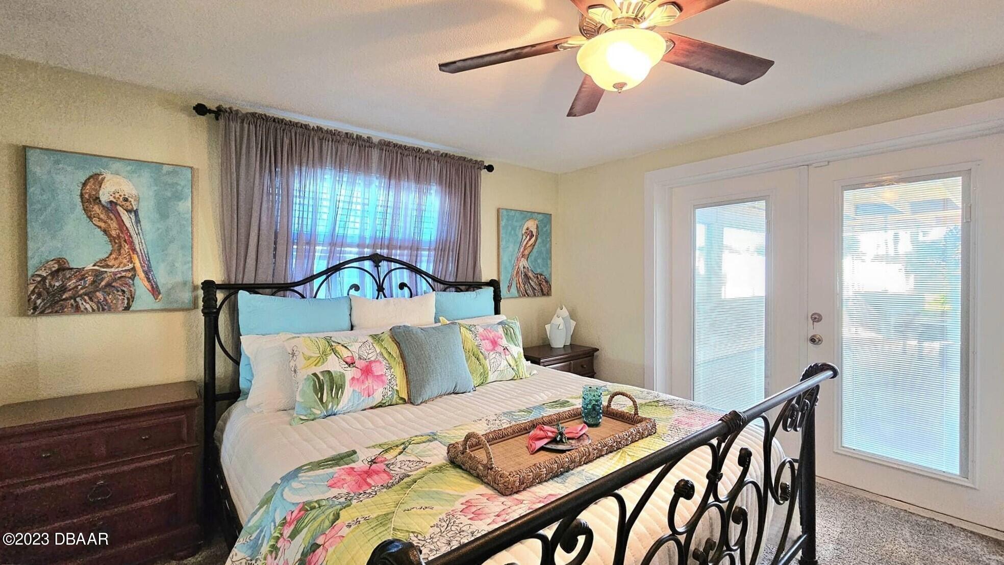 6 Sunrise Avenue Ormond Beach, FL 32176 - Photo 43 of 83 a bedroom with a bed and wooden floor