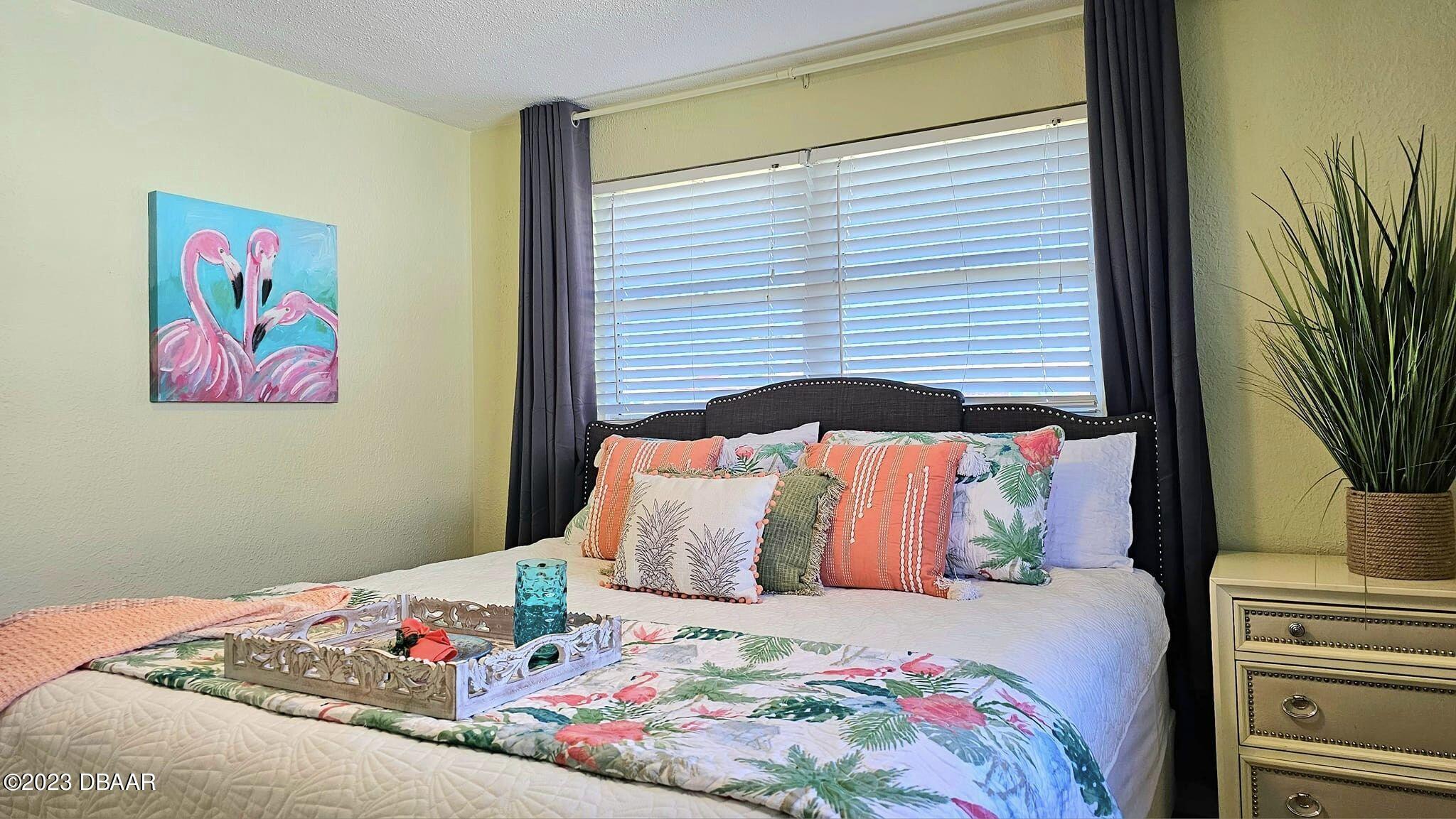 6 Sunrise Avenue Ormond Beach, FL 32176 - Photo 53 of 83 a bedroom with a bed and a flat screen tv