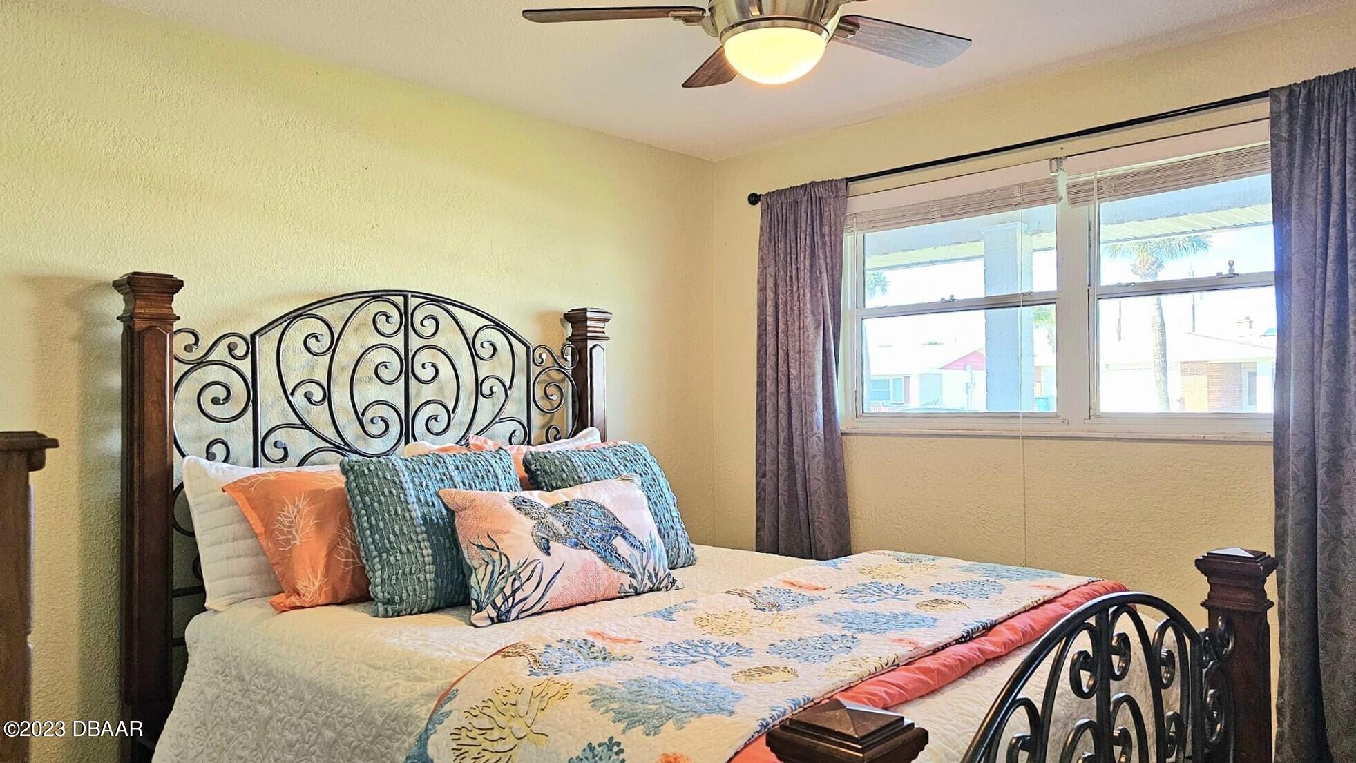 6 Sunrise Avenue Ormond Beach, FL 32176 - Photo 55 of 83 a bedroom with a bed and a window
