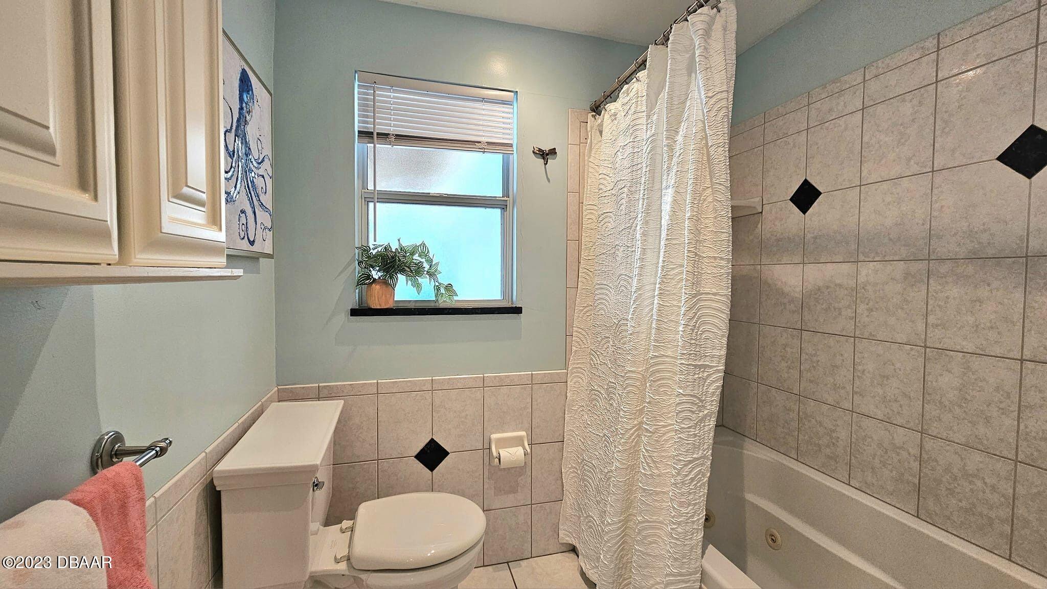 6 Sunrise Avenue Ormond Beach, FL 32176 - Photo 60 of 83 a bathroom with a toilet and a shower