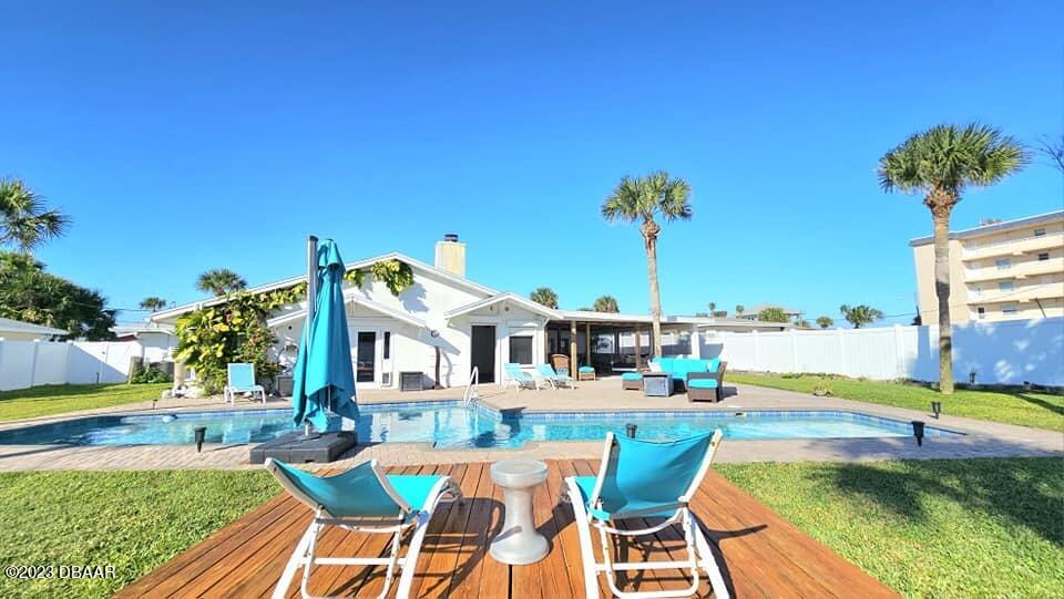 6 Sunrise Avenue Ormond Beach, FL 32176 - Photo 6 of 83 a view of a swimming pool with a lounge chairs