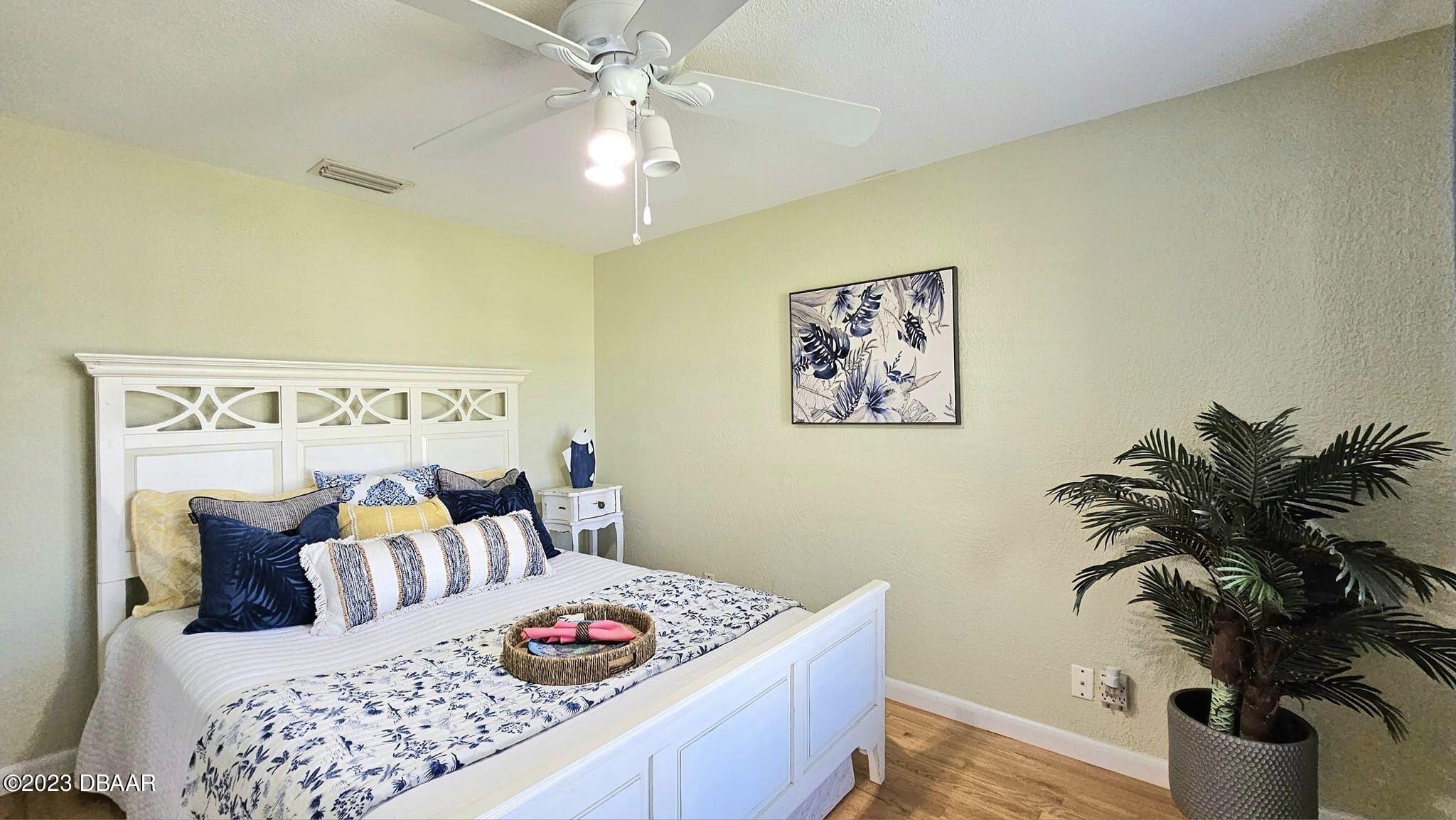 6 Sunrise Avenue Ormond Beach, FL 32176 - Photo 64 of 83 a living room with furniture and a potted plant