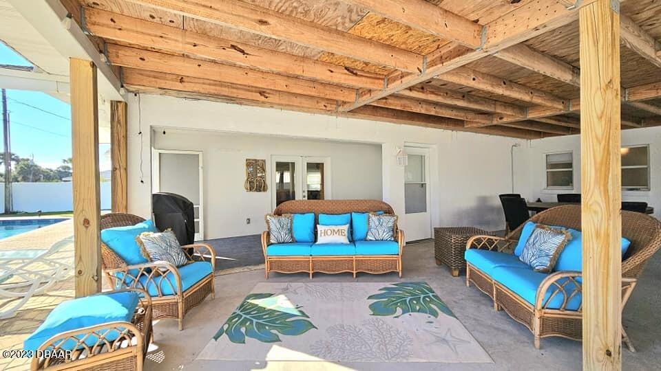 6 Sunrise Avenue Ormond Beach, FL 32176 - Photo 74 of 83 a living room with furniture and a wooden floor