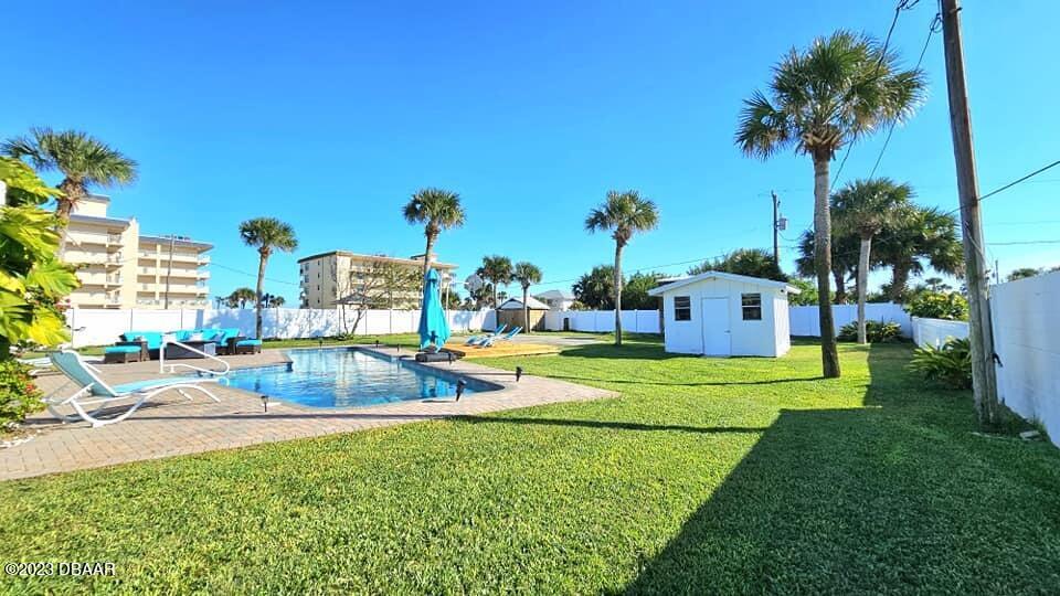 6 Sunrise Avenue Ormond Beach, FL 32176 - Photo 75 of 83 a view of a house with a big yard and palm trees