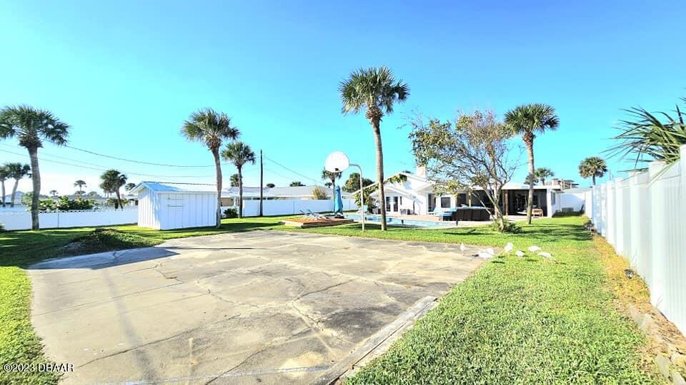 6 Sunrise Avenue Ormond Beach, FL 32176 - Photo 78 of 83 a view of a swimming pool with a lawn chairs