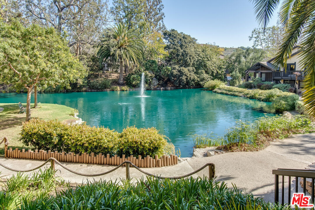 3205 Raintree Circle Culver City, CA 90230 - Photo 14 of 14 a view of a lake with a house in the background