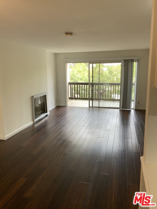 3205 Raintree Circle Culver City, CA 90230 - Photo 4 of 14 a view of an empty room with wooden floor and a window