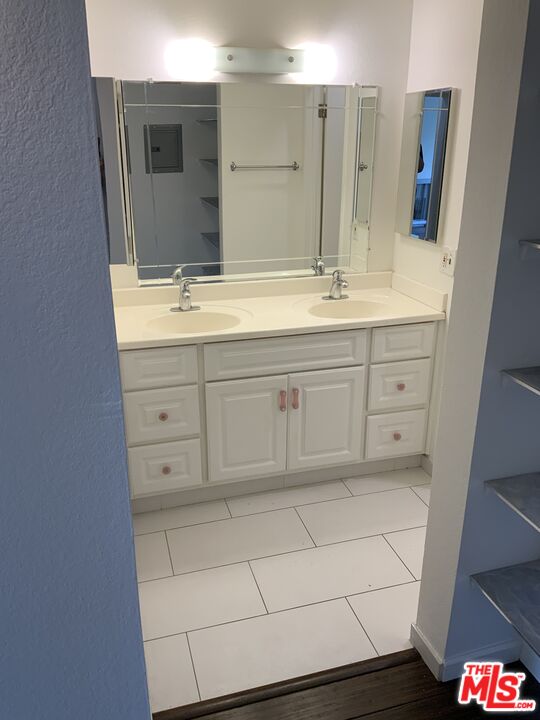 3205 Raintree Circle Culver City, CA 90230 - Photo 9 of 14 a bathroom with a sink and a mirror
