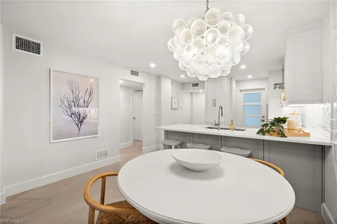 a bathroom with a sink a large mirror and a bathtub