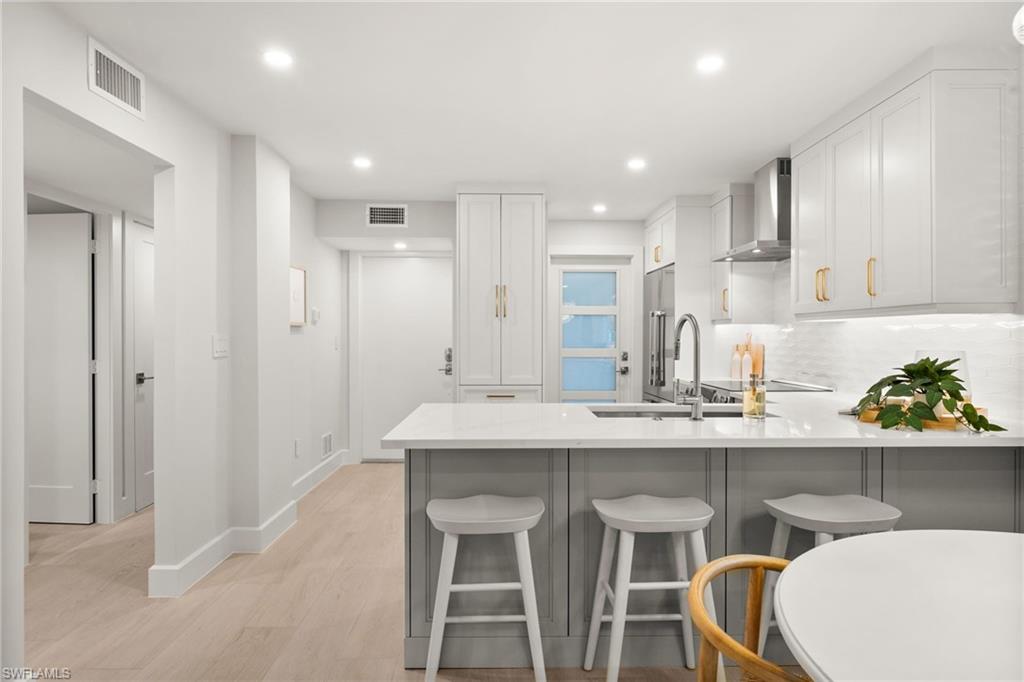 1300 Gulf Shore Boulevard North, Unit 109 Naples, FL 34102 - Photo 17 of 42 LED lighting throughout and tankless water heater enhance efficiency and comfort.