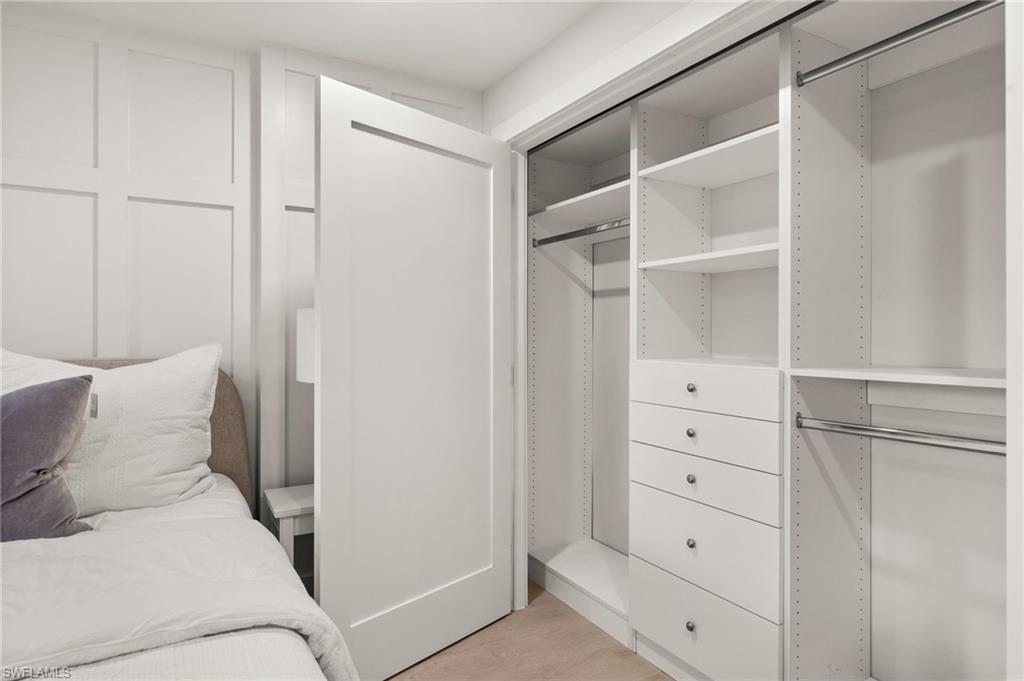 1300 Gulf Shore Boulevard North, Unit 109 Naples, FL 34102 - Photo 22 of 42 Custom-built closet with ample storage and sleek modern design