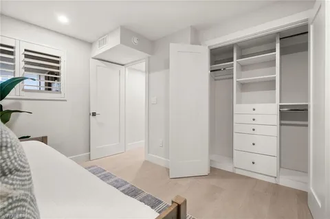 a view of room with cabinet and entryway