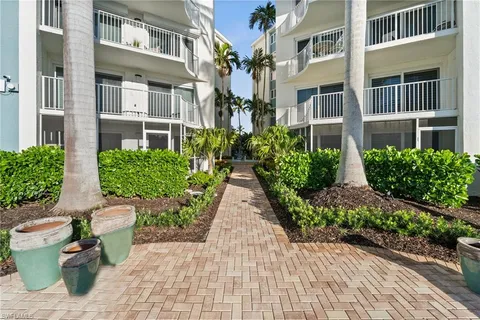 a view of a building with potted plants
