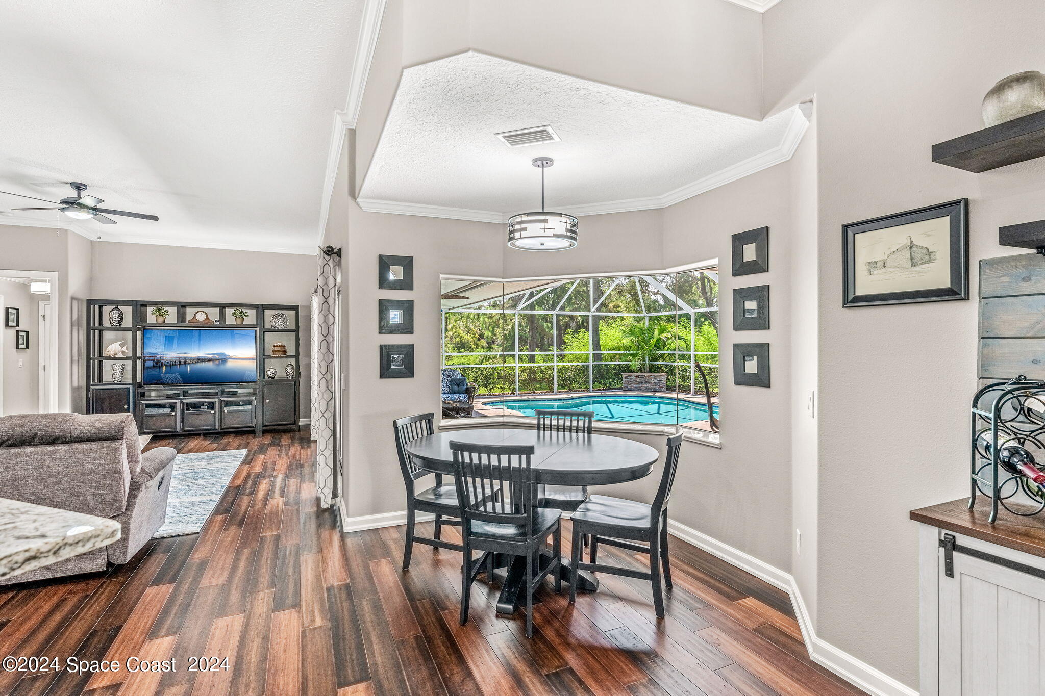 1633 Quinn Drive Rockledge, FL 32955 - Photo 16 of 50 a view of a dining room with furniture window and wooden floor