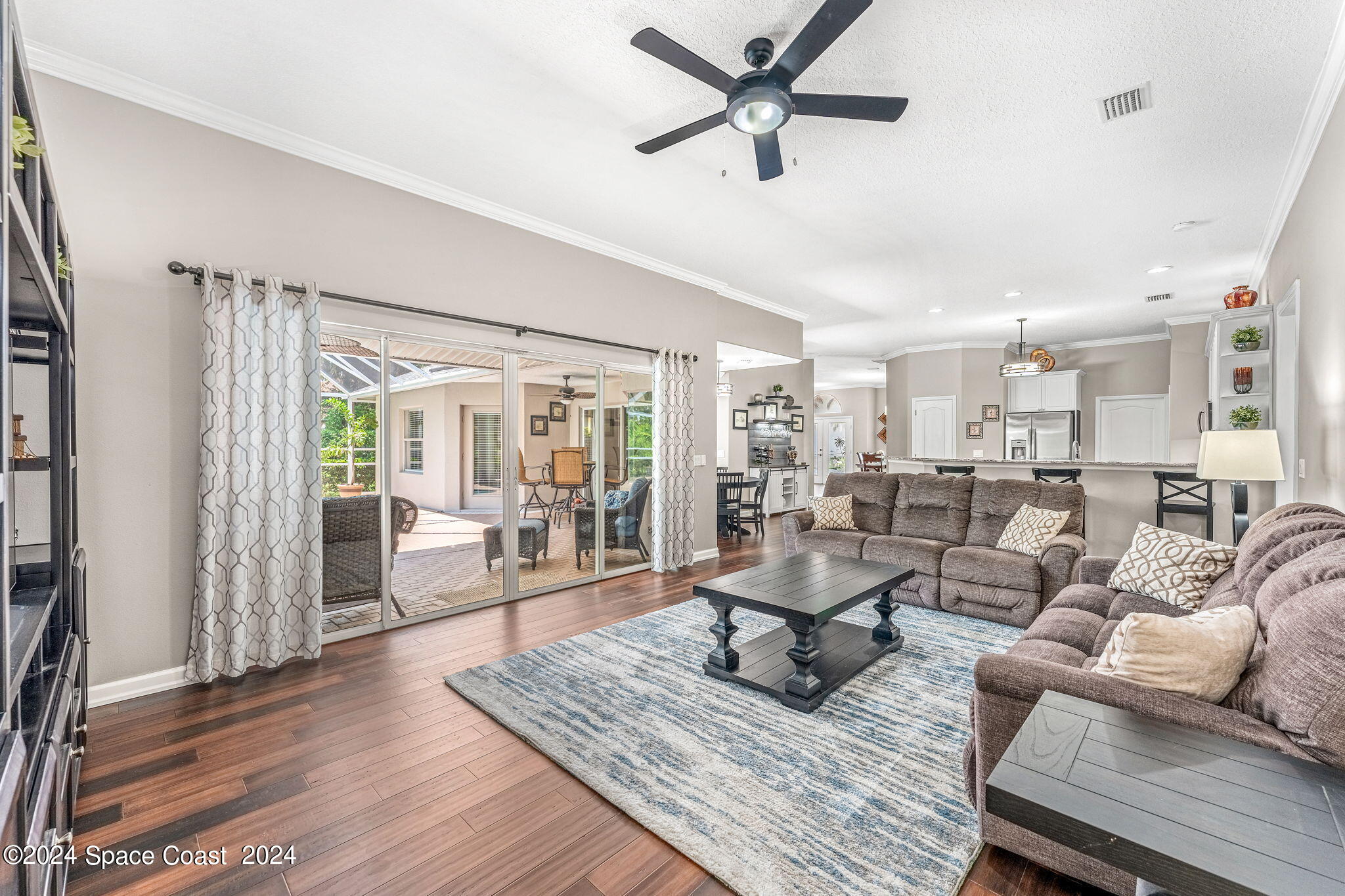 1633 Quinn Drive Rockledge, FL 32955 - Photo 18 of 50 a living room with furniture and a wooden floor