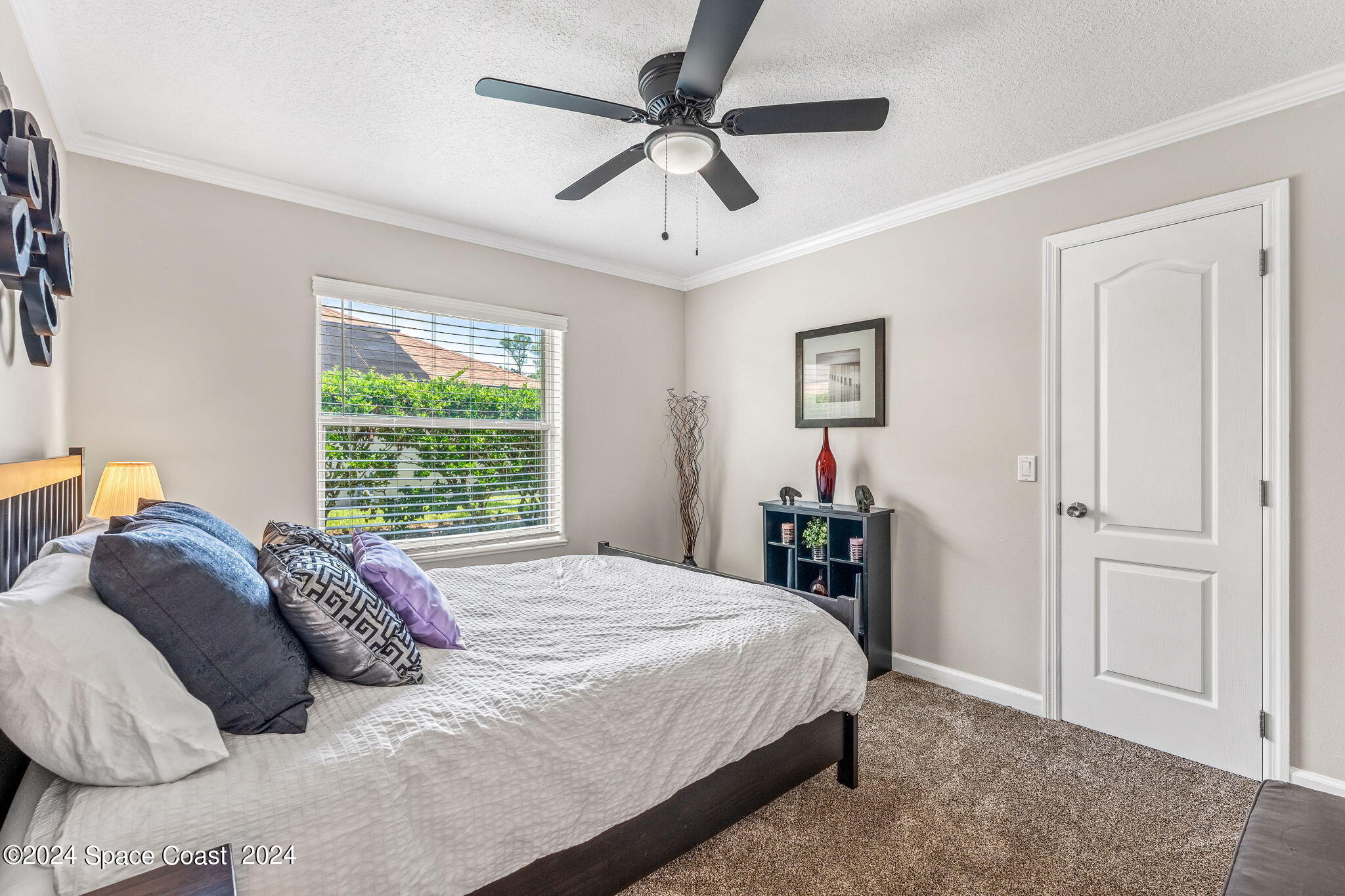 1633 Quinn Drive Rockledge, FL 32955 - Photo 25 of 50 a bedroom with a bed and a chandelier