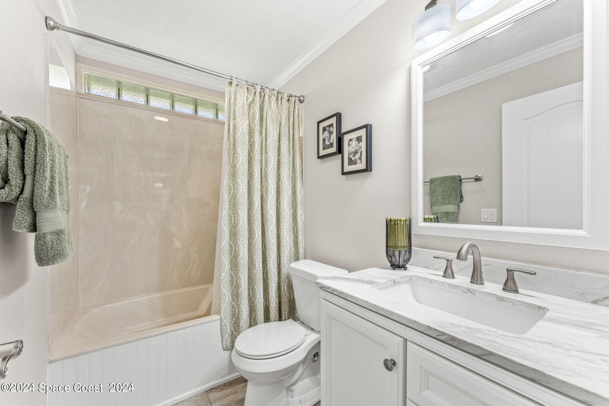 1633 Quinn Drive Rockledge, FL 32955 - Photo 28 of 50 a bathroom with a granite countertop sink toilet and shower
